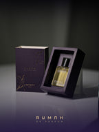 Infinity resting in its plum presentation box beside the gold-marbled outer sleeve